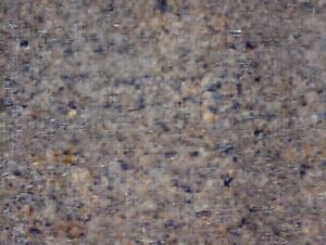 Abstract, textured background image with muted brown and grey tones, suitable for a recipe post about a cabbage recipe.